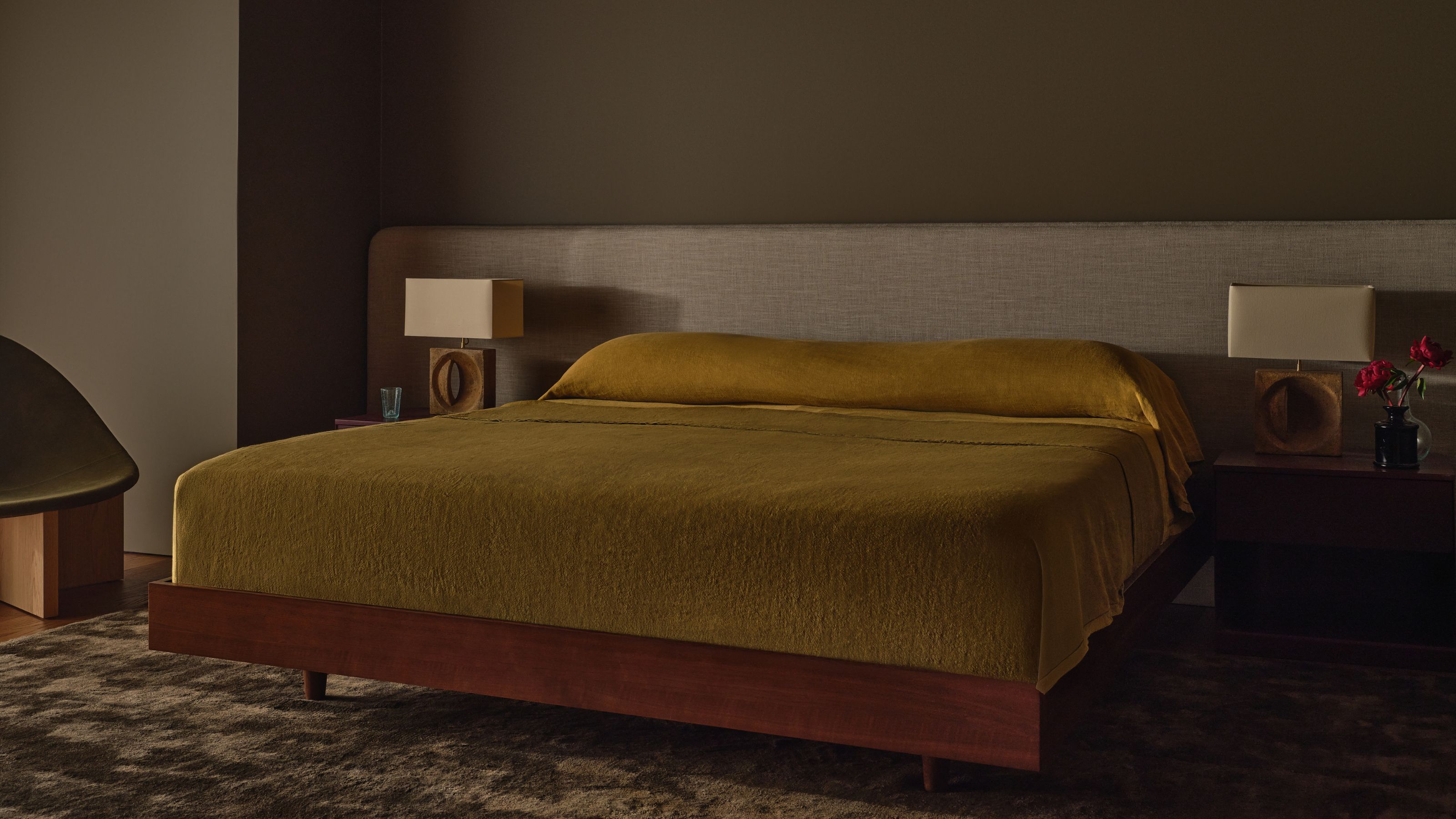 Modern bedroom with dark brown walls. 