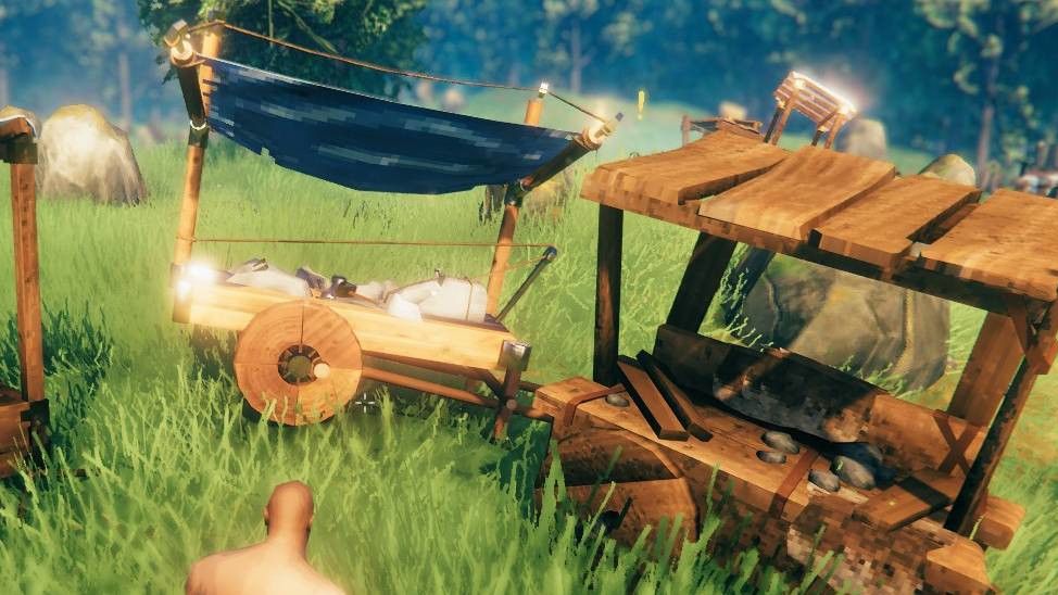 Crafting tables attached to carts in Valheim.