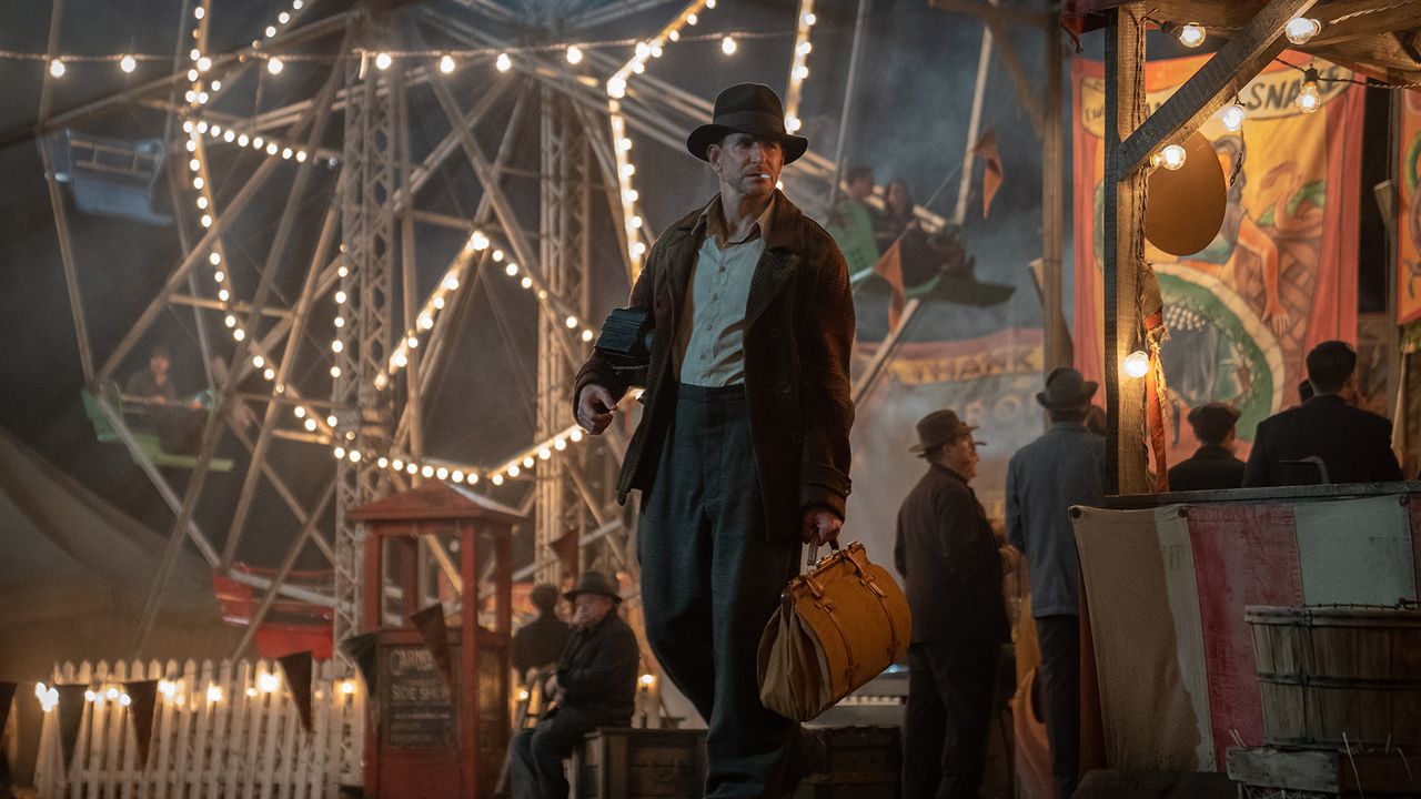 Nightmare Alley image showing Bradley Cooper at a carnival