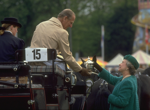 The Queen presents Prince Philip with a trophy at the 1991 Royal Windsor Horse Show