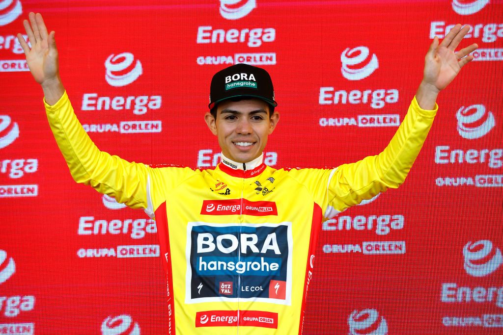 PRZEMYSL POLAND AUGUST 01 Sergio Andres Higuita Garcia of Colombia and Team Bora Hansgrohe celebrates at podium as Yellow Leader Jersey winner during the 79th Tour de Pologne 2022 Stage 3 a 2379km stage from Kranik to Przemyl TdP22 WorldTour on August 01 2022 in Przemysl Poland Photo by Bas CzerwinskiGetty Images