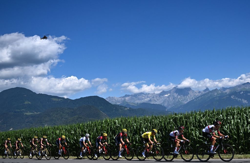 UAE Team Emirates teams Slovenian rider Tadej Pogacar wearing the overall leaders yellow jersey 3rd R cycles with the pack of riders during the 9th stage of the 109th edition of the of the Tour de France cycling race 1929 km between Aigle in Switzerland and Chatel Les Portes du Soleil in the French Alps on July 10 2022 Photo by AnneChristine POUJOULAT AFP Photo by ANNECHRISTINE POUJOULATAFP via Getty Images