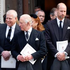 Prince Andrew laughs with King Charles, as Prince William looks awkward