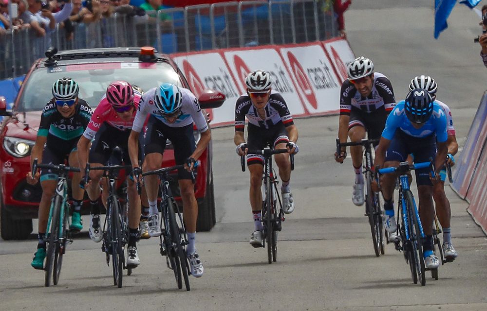 Chris Froome and Wout Poels sprint for the line at the end of stage 20
