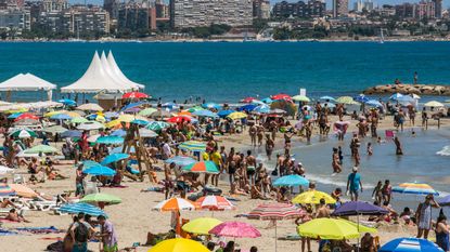 ALICANTE, SPAIN - 2016/08/07: El Postiguet Beach in Alicante. Alicante city is crowded with tourists during the month of August where high temperatures and sunny days are expected. (Photo by Marcos del Mazo/LightRocket via Getty Images)