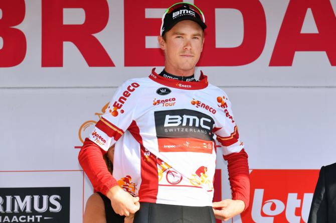 Rohan Dennis pulling on the leader's jersey