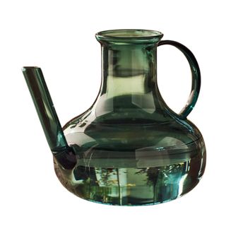 Green glass watering can