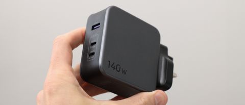 Ugreen Nexode 140W charger held in a hand