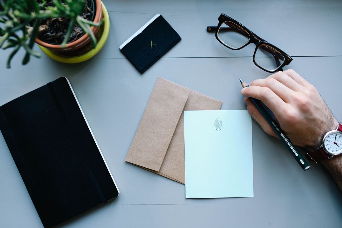 ridiculous job titles: person with notebook and pen