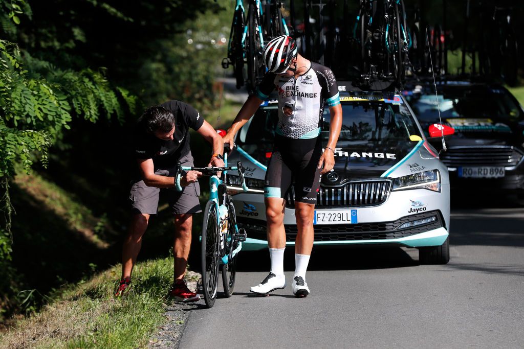 BUKOVINA RESORT POLAND AUGUST 12 Alexander Konychev of Italy and Team BikeExchange assisted by a mechanic due to a mechanical problem during the 78th Tour de Pologne 2021 Stage 4 a 160km stage from Azoty Group Tarnw to Bukovina Resort 924m TourdePologne TDP2021 UCIWT on August 12 2021 in Bukovina Resort Poland Photo by Bas CzerwinskiGetty Images