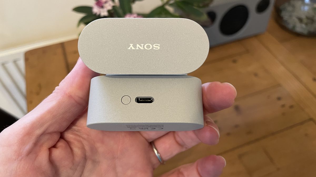 Sony WF-1000XM6 earbuds next to the older-gen. WF-1000XM5 and WF-C710N, on colorful table