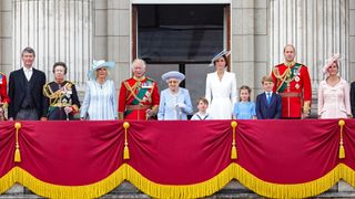 The Royal Family, including Queen Elizabeth, Princess Anne and Sir Timothy Laurence, stand on the Buckingham Palace balcony during Trooping the Colour 2022