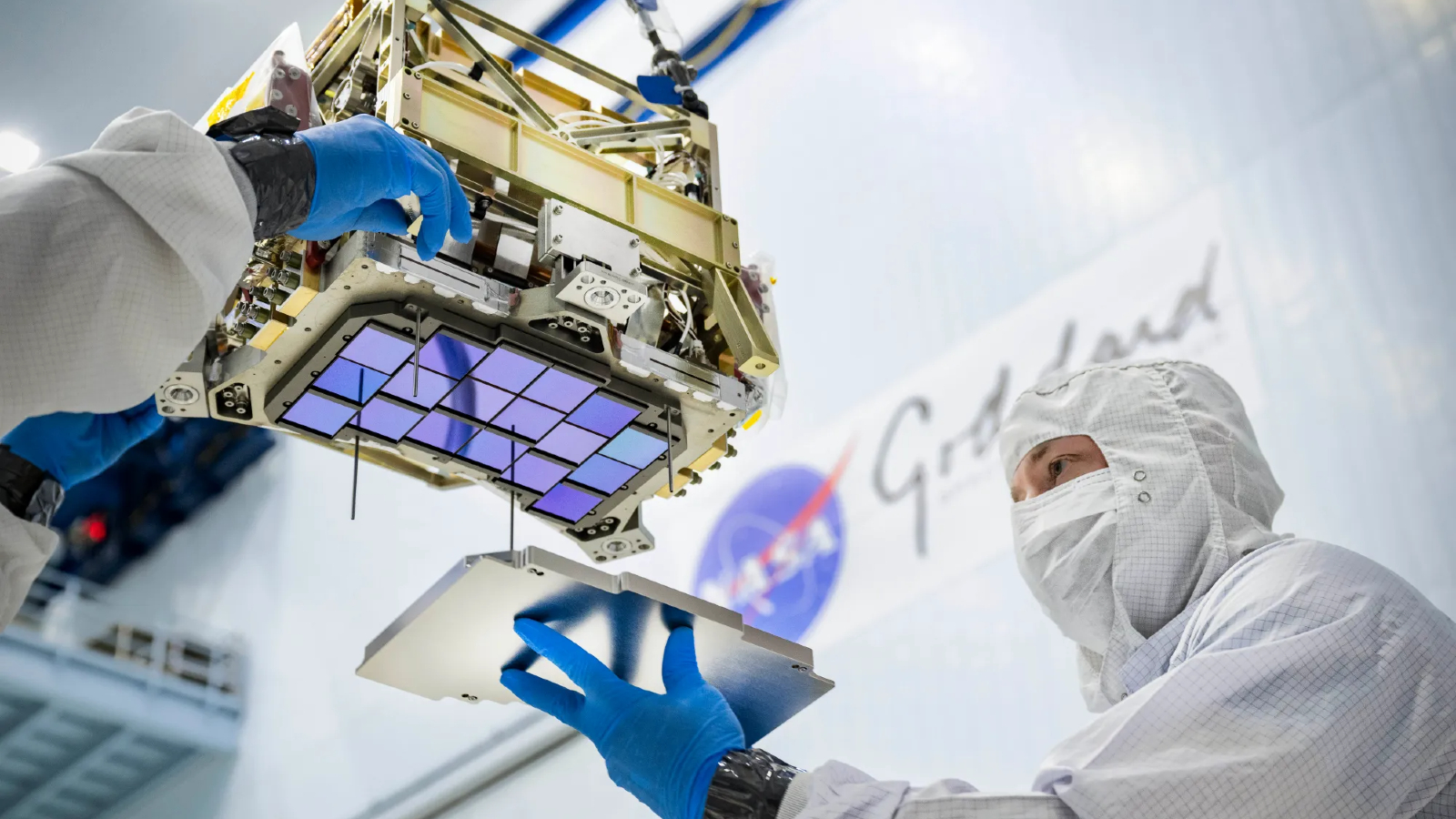 A close-up of a researcher attaching a component to the Roman telescope