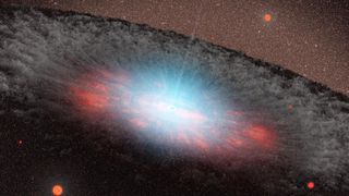 An illustration of a bright black hole at the center of a galaxy, surrounded by a dusty ring of rubble