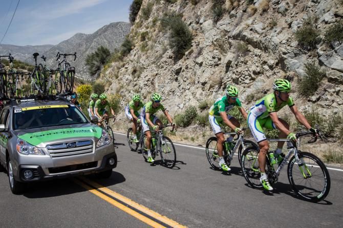 Cannondale gets direction from the team car heading towards the finish