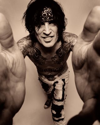 Tommy Lee of Motley Crue poses for a studio portrait session backstage at the Download Festival, Donington Park, Leicestershire on June 12th, 2009