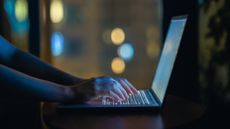 A stock photo of a pair of hands typing on the computer. 