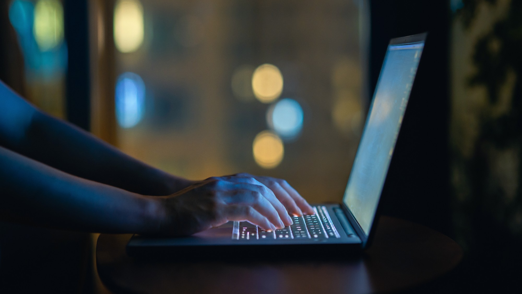 A stock photo of a pair of hands typing on the computer. 