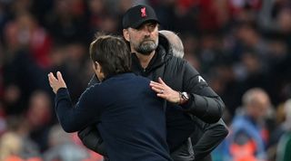 Liverpool manager Jurgen Klopp and Tottenham Hotspur head coach Antonio Conte shake hands after the Premier League match between Liverpool and Tottenham Hotspur on 7 May, 2022 at Anfield, Liverpool, United Kingdom