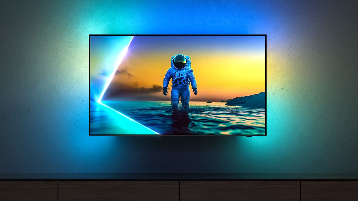 The Philips OLED810 TV mounted on a wall, with an astronaut on-screen, with Ambilight spreading light onto the wall around it