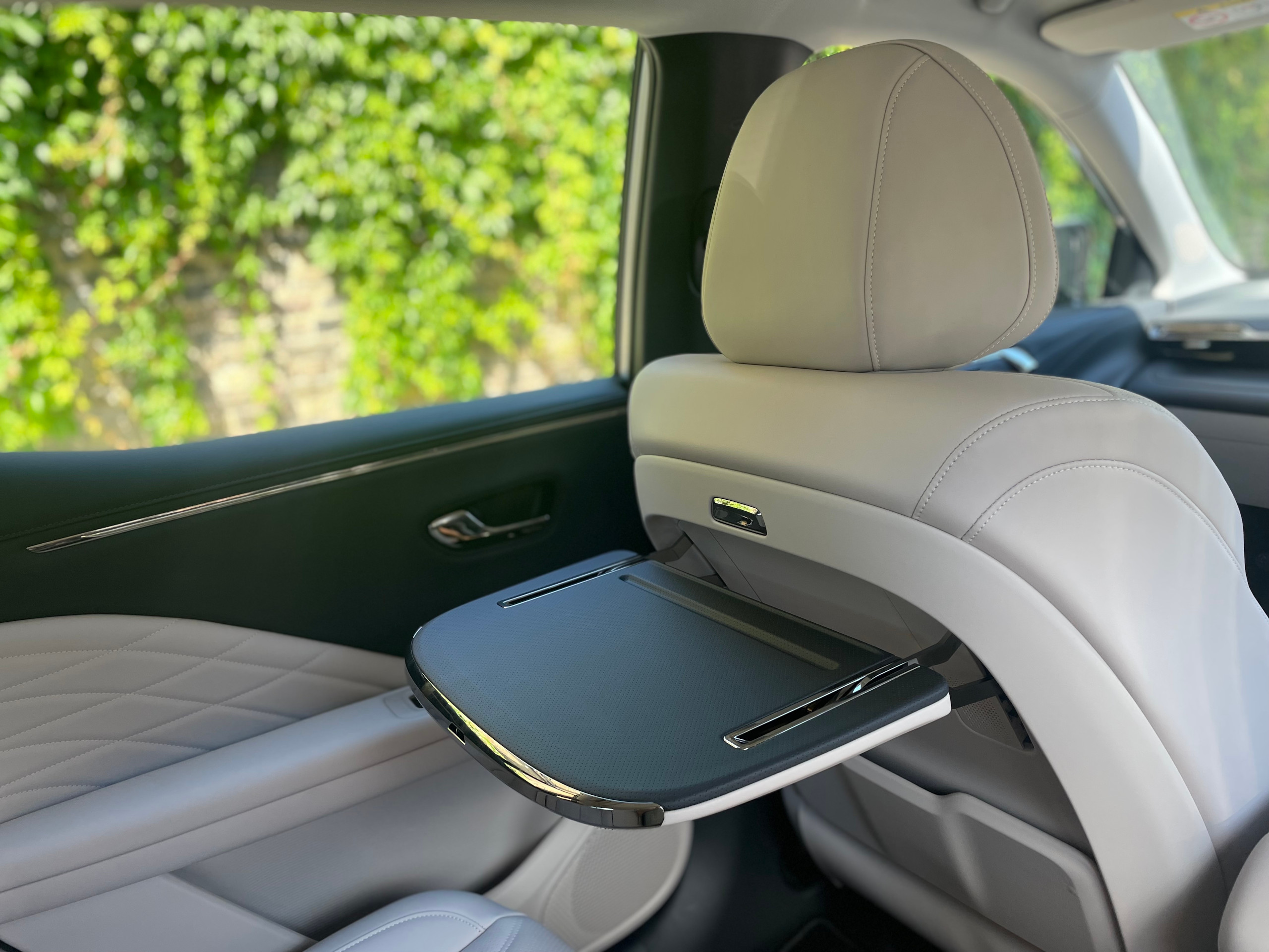 The rear laptop table in the Aion V