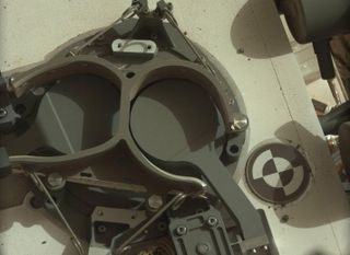 Camera onboard Curiosity shows the covers in place over two sample inlet funnels of the rover's Sample Analysis at Mars (SAM) instrument suite. Curiosity delivered SAM's first soil sample on the day this image was taken, the 93rd Martian day, or sol, of the mission (Nov. 9).