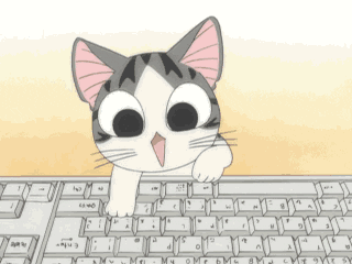 Adorable cat typing on a keyboard