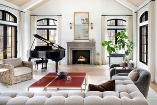 A living room with a fireplace in the middle
