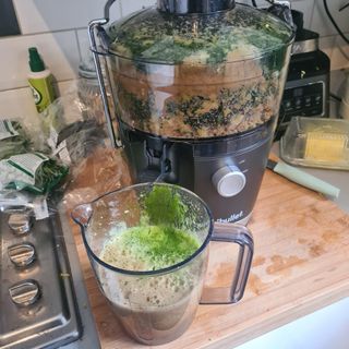 Nutribullet juicer being used with apples