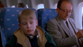 Kevin sitting on a random seat on an airplane in Home Alone 2: Lost in New York.