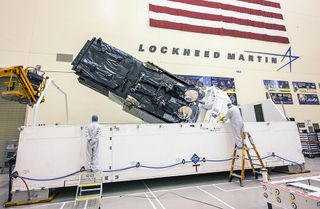 Engineers at Lockheed Martin prepare the SBIRS Geo-5 satellite for shipment to Cape Canaveral.