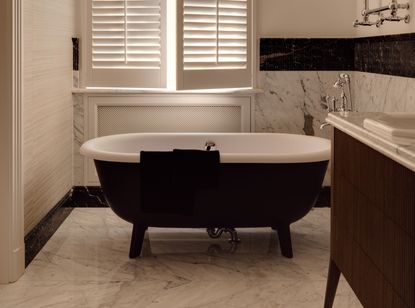 A family bathroom with freestanding bath