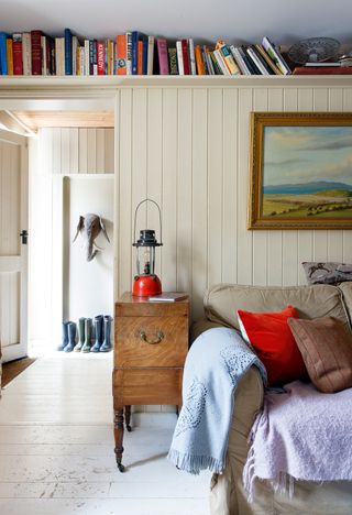 hallway with sofa and boot storage