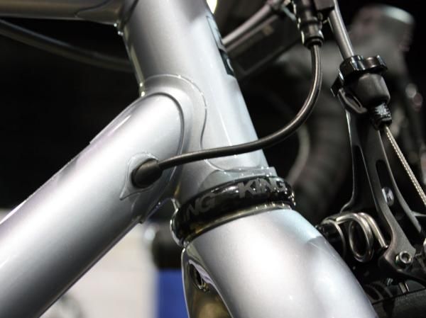The Di2 wire enters the frame just aft of the head tube at this neat brazed-on port.