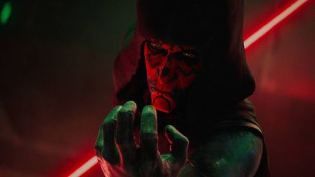 Maul (Sam Witwer) in a hood, using the force, with his dual lightsaber drawn in Maul &ndash;&nbsp;Shadow Lord
