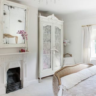 white bedroom with wardrobe and mirror