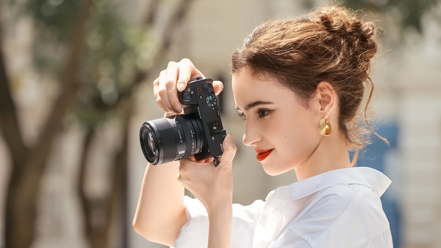 The Viltrox AF 90mm f/2.2 lens used by a photographer