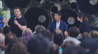 SpaceX CEO Elon Musk and Japanese entrepreneur Yusaku Maezawa, who has booked SpaceX's first private flight around the moon on a Big Falcon Rocket, meet the press during the mission's unveiling at the company's headquarters in Hawthorne, California on Sept. 17, 2018.