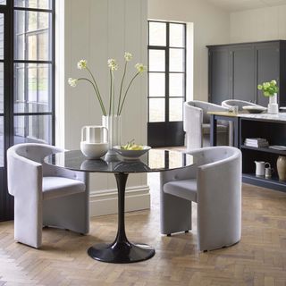 White dining room with panelled wall