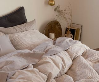 Parachute bedding on a bed against a white wall.