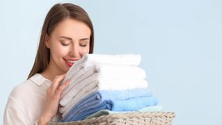 Woman smelling a white towel