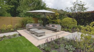 square patio with seating and parasol