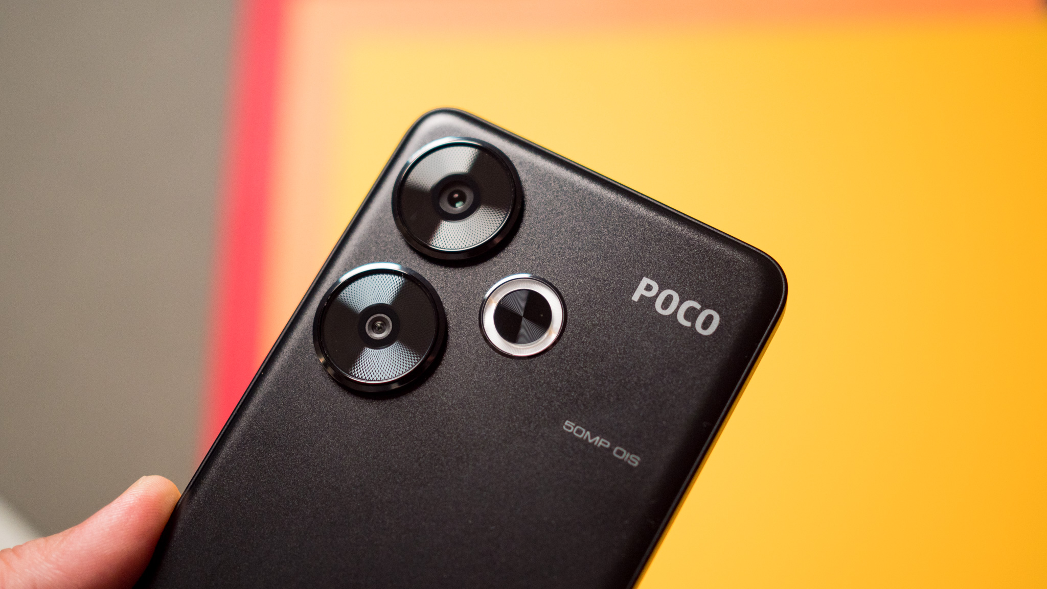 POCO F6 in-hand view highlighting camera modules