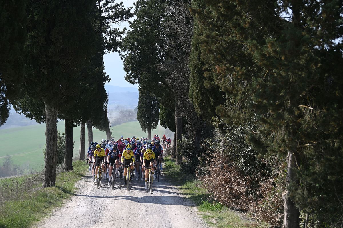 The peloton enters the stunning white gravel roads of Tuscany