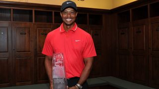 Tiger Woods with the 2013 Players Championship trophy
