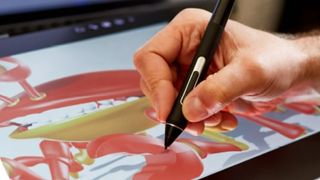 Best drawing tablet - an artist painting on a Wacom tablet 
