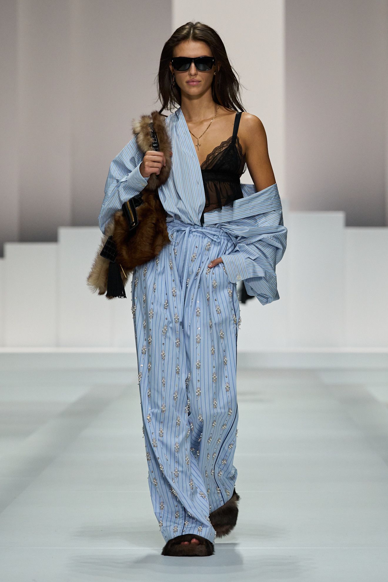 Women on dolce & Gabbana runway show wearing pajama-inspired outfits.