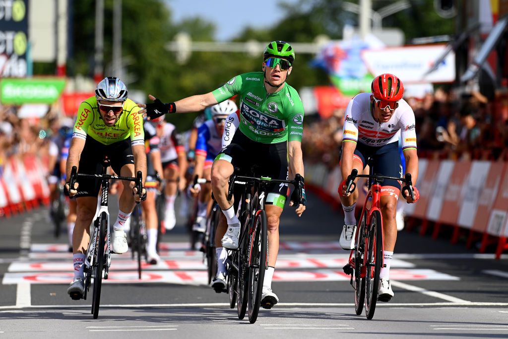 BREDA NETHERLANDS AUGUST 21 Sam Bennett of Ireland and Team Bora Hansgrohe Green Points Jersey celebrates winning ahead of Mads Pedersen of Denmark and Team Trek Segafredo and Daniel Mclay of United Kingdom and Team Arka Samsic during the 77th Tour of Spain 2022 Stage 3 a 1932km stage from Breda to Breda LaVuelta22 WorldTour on August 21 2022 in Breda Netherlands Photo by Tim de WaeleGetty Images