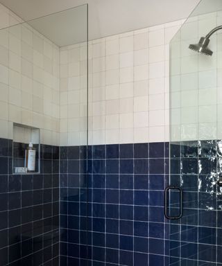 Navy and white zellige tiles used in a shower nook