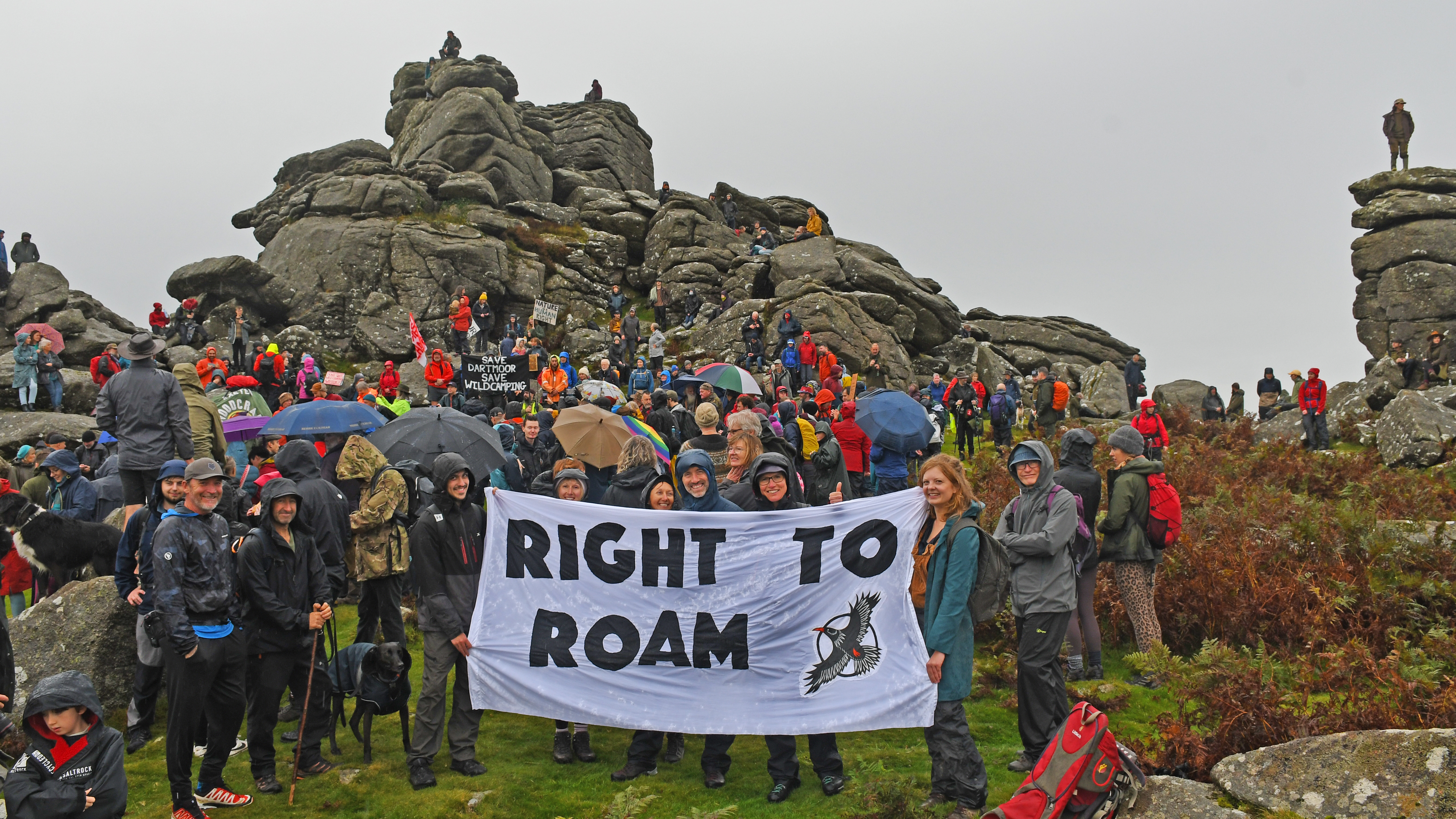 Right to Roam campaigners hold a banner in front of Hound Tor